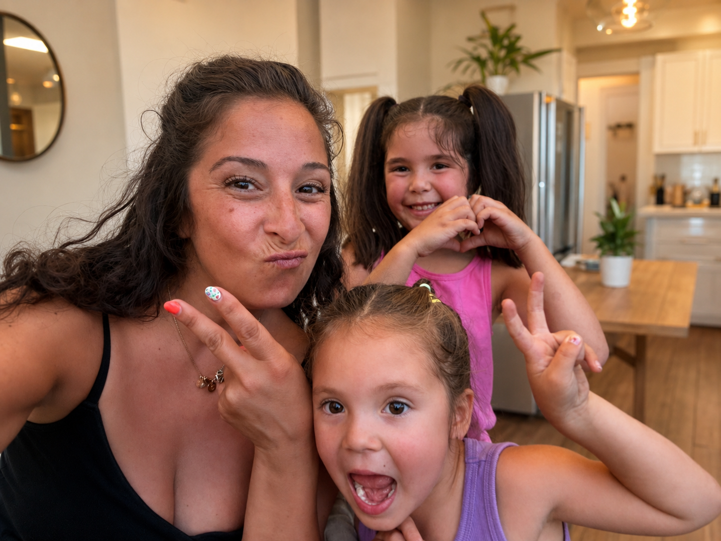 Michelle with her daughters in the kitchen