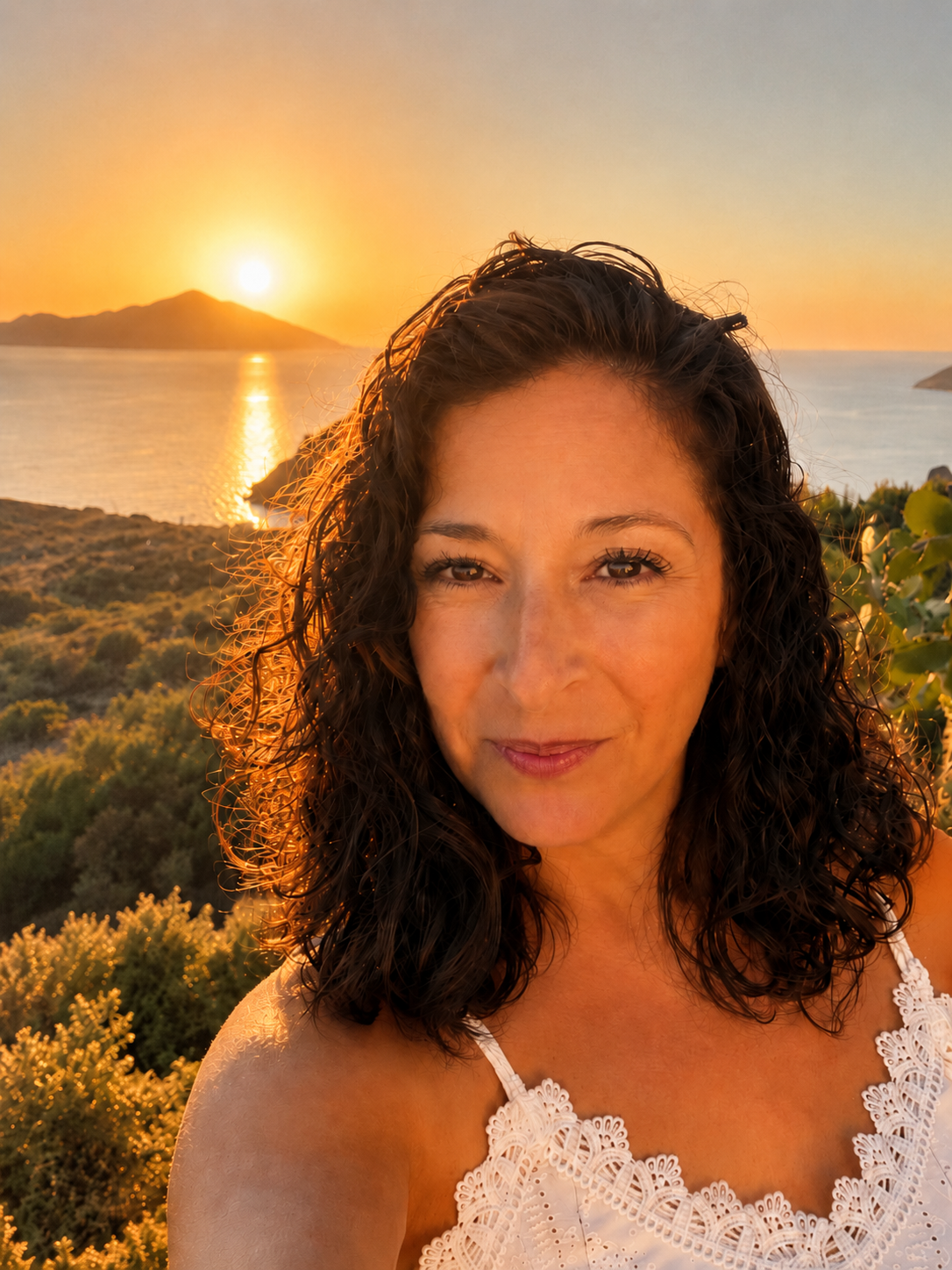 Michelle watching the sunset over the sea