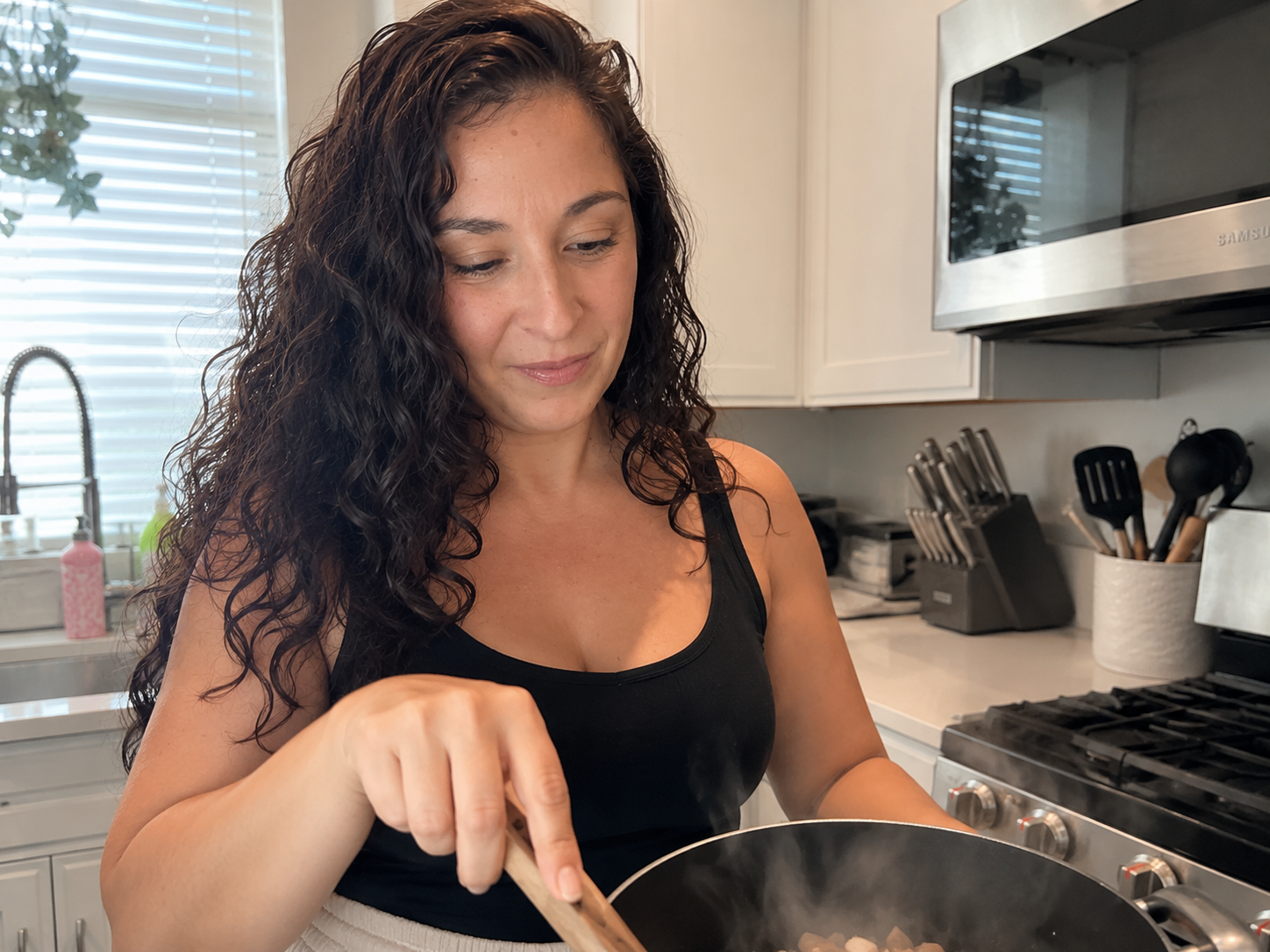 Michelle cooking in her kitchen